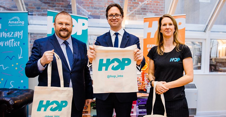 Adrian Hawkins, Minister for Skills Alex Burghart and Caroline Cartwright at the HOP stand